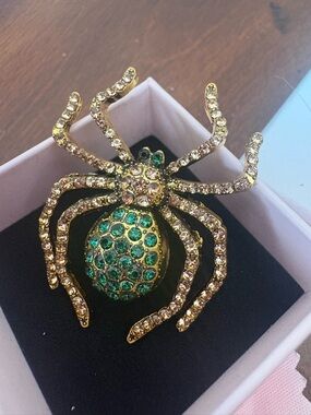 Gold Tone Spider Brooch with Green and Clear Rhinestones